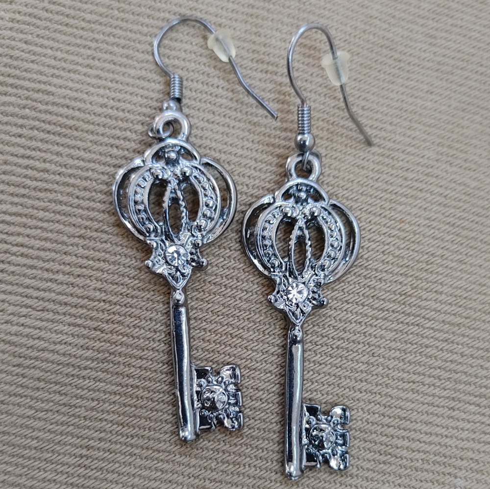 Silver tone stylized key hook earrings